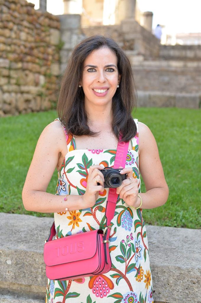 founder of the travel blog Memories of the Pacific, smiling at the camera.